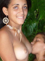 Busty ebony babe demonstrates her nice naked body in the jungle
